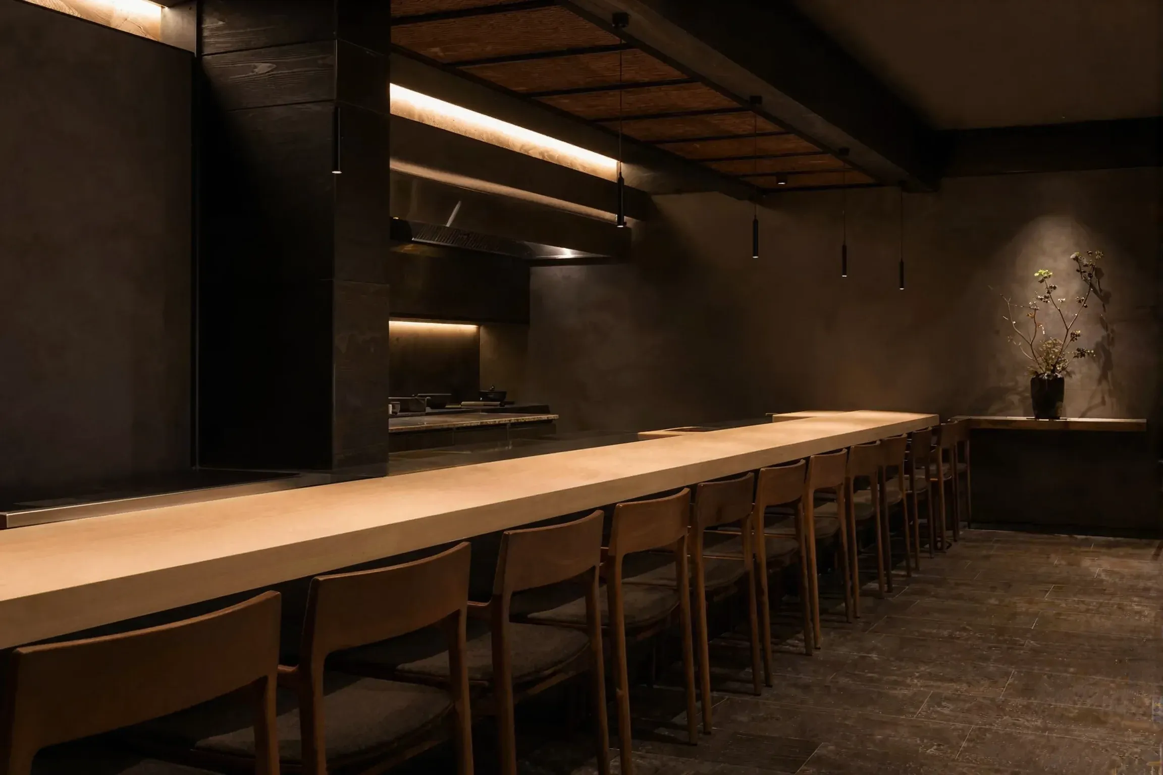 The long hinoki counter under warm downlights
