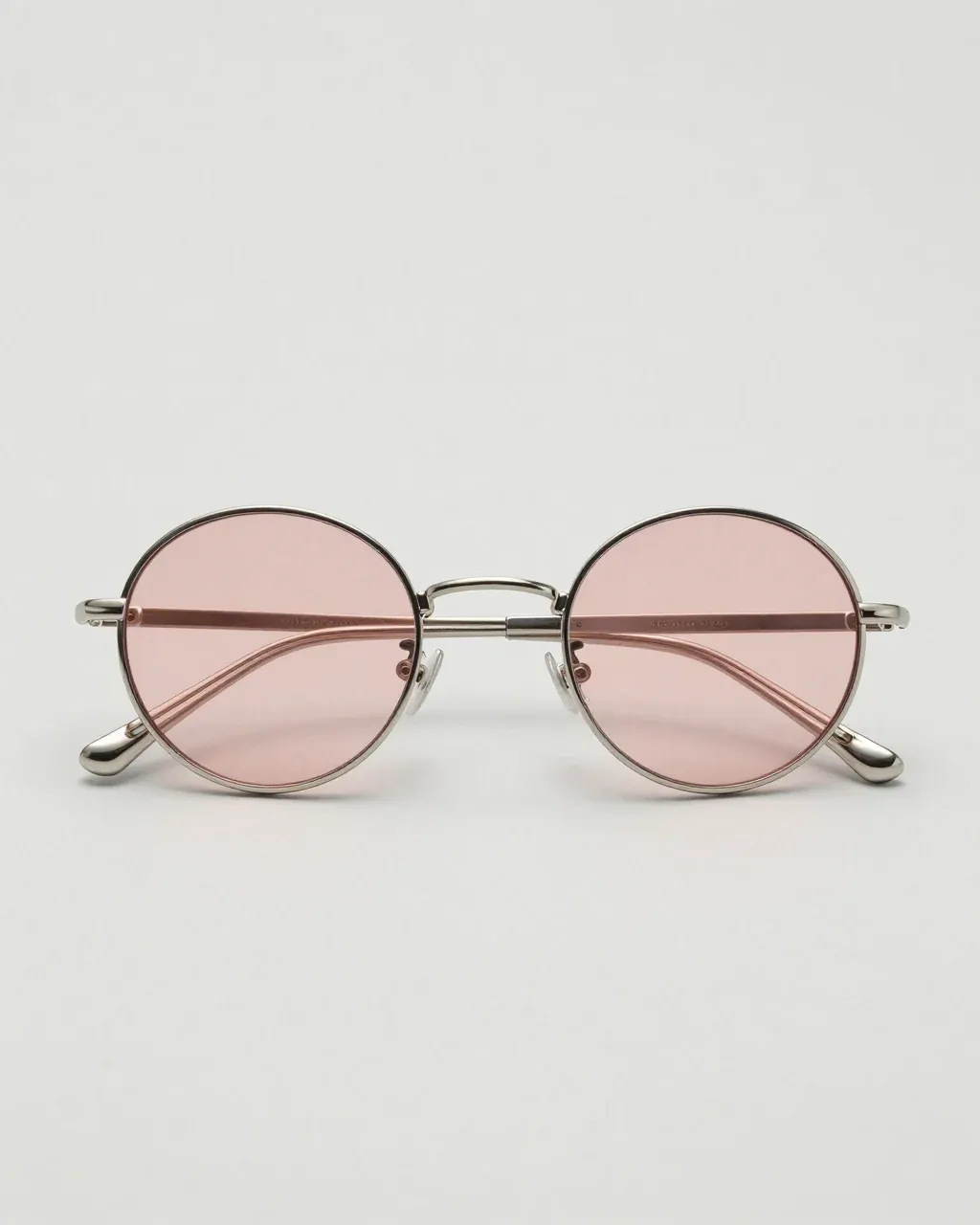 HALO: thin silver titanium round sunglasses with rose lenses